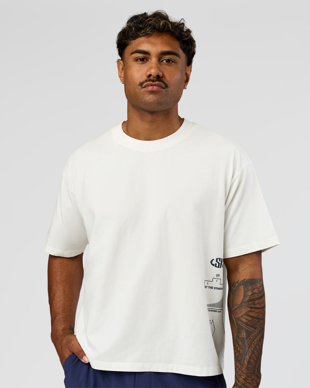 Man wearing Greatest of All Time Heavyweight FLXCotton Boxed Tee - Off White Washed | Model:Xav | Size:L - view 7