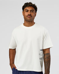 Man wearing Greatest of All Time Heavyweight FLXCotton Boxed Tee - Off White Washed | Model:Xav | Size:L | Thumbnail Index: 6