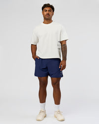 Man wearing Greatest of All Time Heavyweight FLXCotton Boxed Tee - Off White Washed | Model:Xav | Size:L | Thumbnail Index: 10