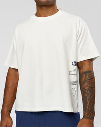 Man wearing Greatest of All Time Heavyweight FLXCotton Boxed Tee - Off White Washed | Model:Xav | Size:L | Thumbnail Index: 7