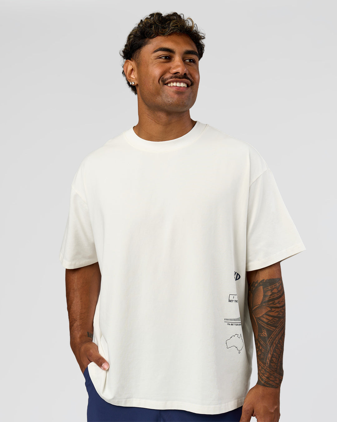 Man wearing Greatest of All Time Heavyweight FLXCotton Oversized Tee - Off White Washed-Scarlet | Model:Xav | Size:L - view 14
