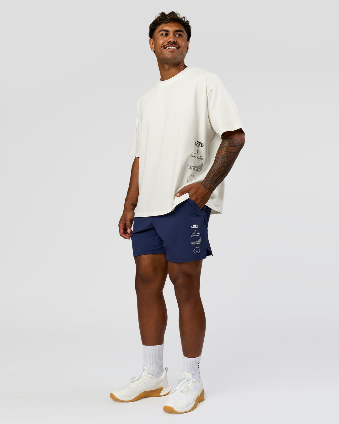 Man wearing Greatest of All Time Heavyweight FLXCotton Oversized Tee - Off White Washed-Scarlet | Model:Xav | Size:L - view 16