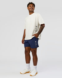 Man wearing Greatest of All Time Heavyweight FLXCotton Oversized Tee - Off White Washed-Scarlet | Model:Xav | Size:L | Thumbnail Index: 15