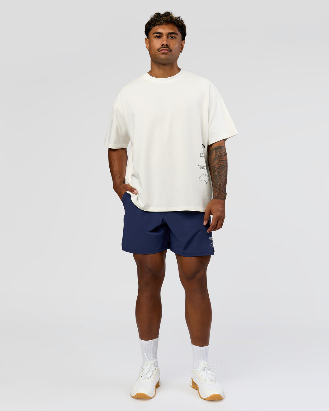 Man wearing Greatest of All Time Heavyweight FLXCotton Oversized Tee - Off White Washed-Scarlet | Model:Xav | Size:L - view 18