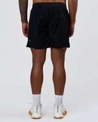 Man wearing Hybrid Lined 7" Short - Black | Model:Xav | Size:L | Thumbnail Index: 2