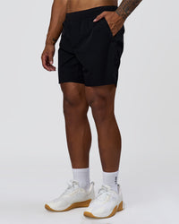 Man wearing Hybrid Lined 7" Short - Black | Model:Xav | Size:L | Thumbnail Index: 4