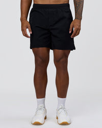 Man wearing Hybrid Lined 7" Short - Black | Model:Xav | Size:L | Thumbnail Index: 5