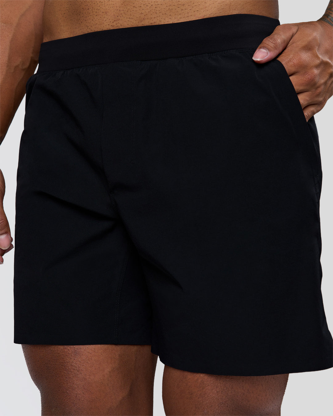 Man wearing Hybrid Lined 7" Short - Black | Model:Xav | Size:L - view 7