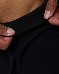 Man wearing Hybrid Lined 7" Short - Black | Model:Xav | Size:L | Thumbnail Index: 7