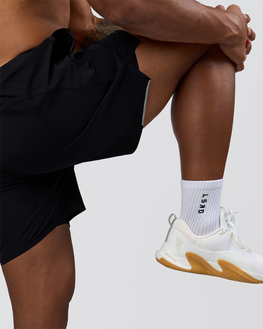 Man wearing Hybrid Lined 7" Short - Black | Model:Xav | Size:L - view 11