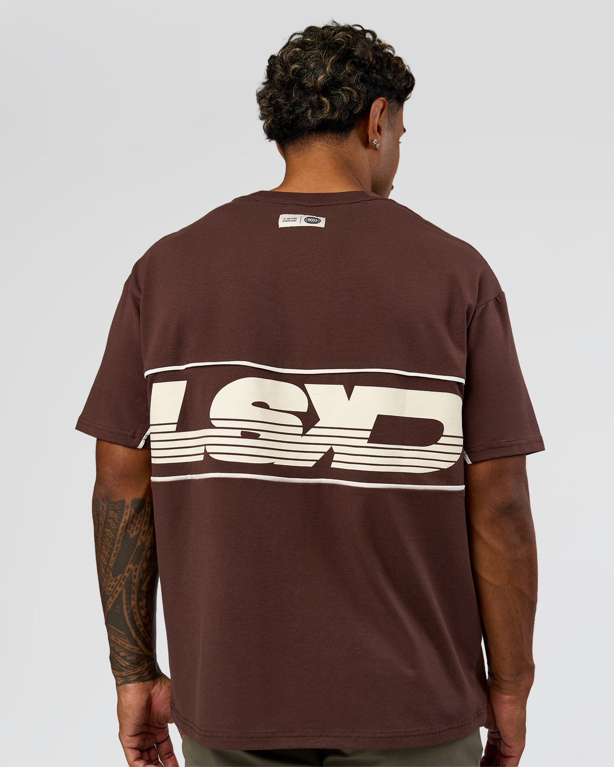 Man wearing Inline Heavyweight FLXCotton Oversized Tee - Hot Chocolate-Off White | Model:Xav | Size:L