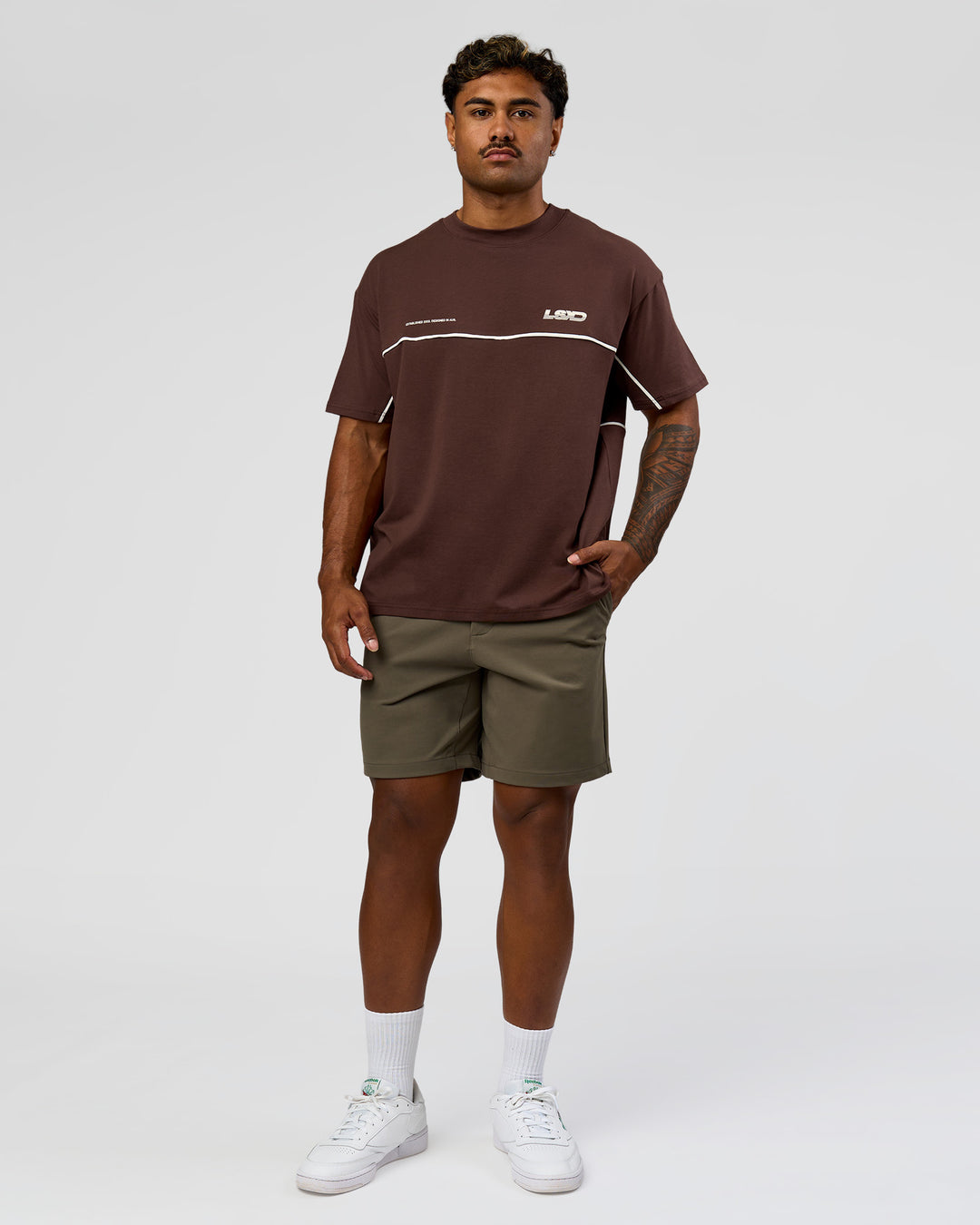 Man wearing Inline Heavyweight FLXCotton Oversized Tee - Hot Chocolate-Off White | Model:Xav | Size:L - view 12
