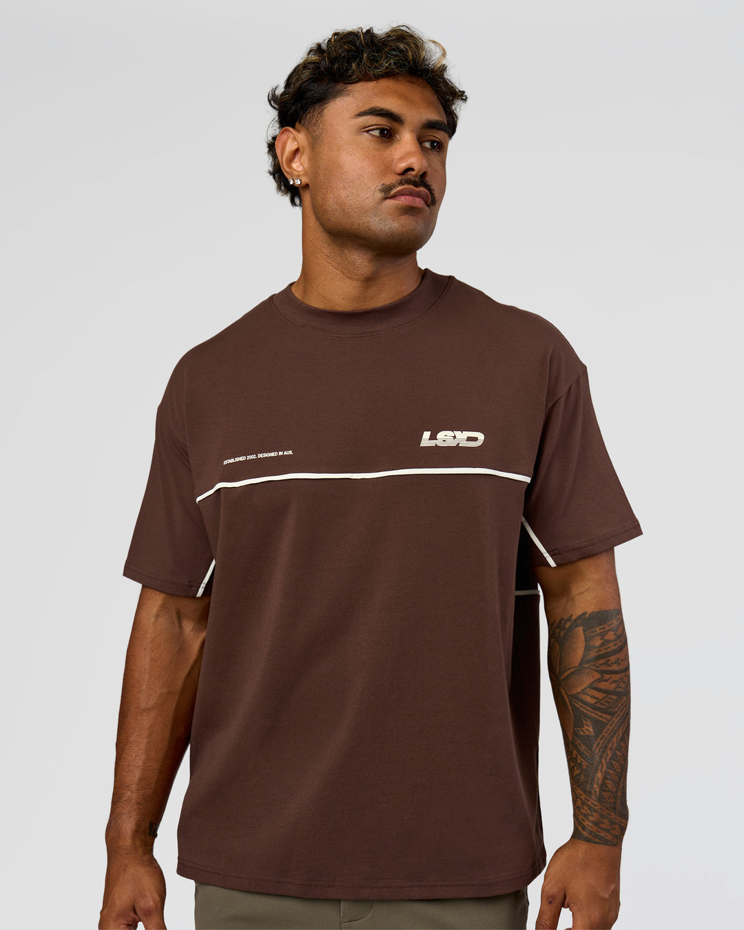 Man wearing Inline Heavyweight FLXCotton Oversized Tee - Hot Chocolate-Off White | Model:Xav | Size:L - view 14
