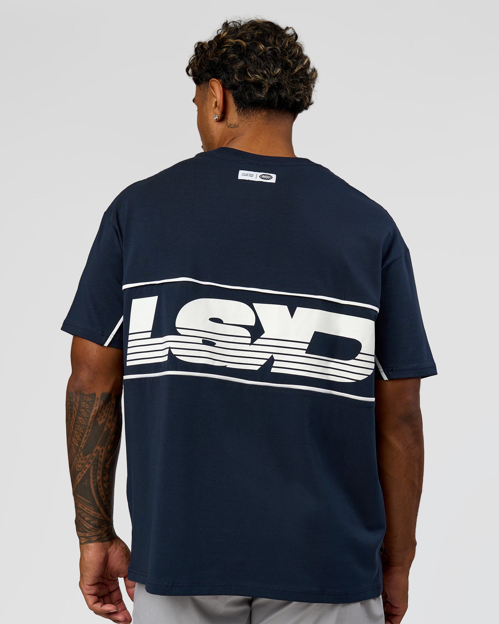Man wearing Inline Heavyweight FLXCotton Oversized Tee - Midnight Navy-White | Model:Xav | Size:L