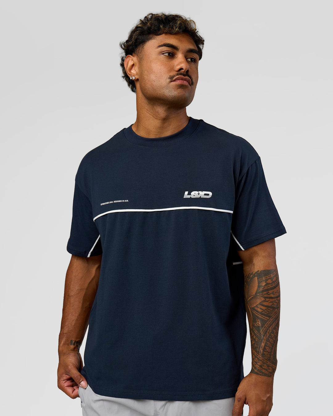 Man wearing Inline Heavyweight FLXCotton Oversized Tee - Midnight Navy-White | Model:Xav | Size:L - view 9
