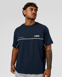 Man wearing Inline Heavyweight FLXCotton Oversized Tee - Midnight Navy-White | Model:Xav | Size:L | Thumbnail Index: 8