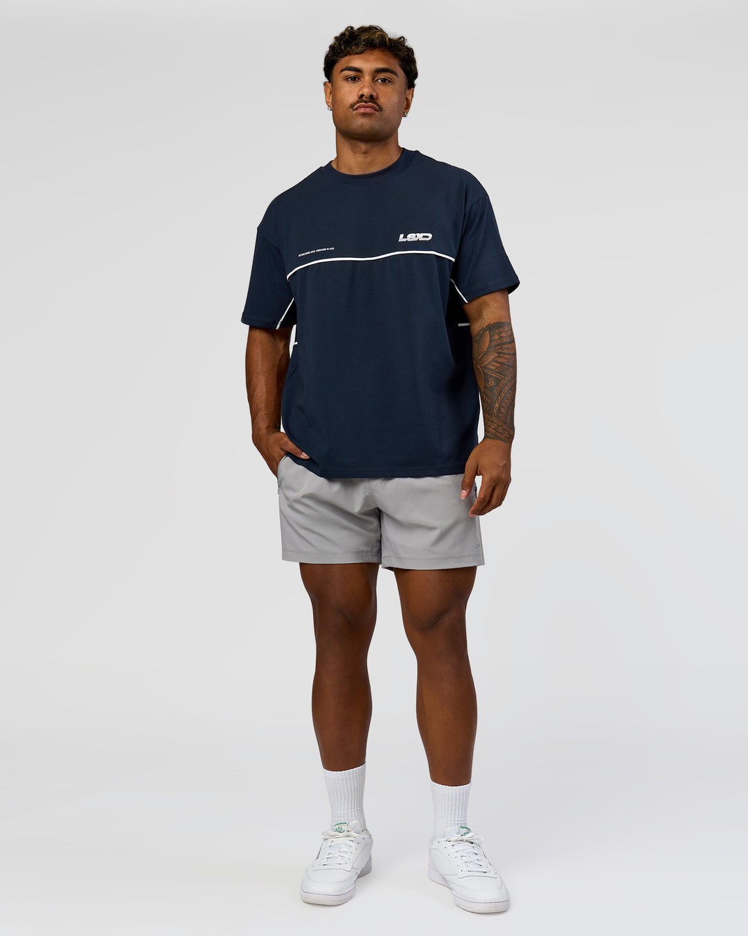 Man wearing Inline Heavyweight FLXCotton Oversized Tee - Midnight Navy-White | Model:Xav | Size:L - view 12