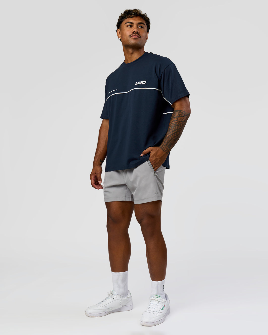 Man wearing Inline Heavyweight FLXCotton Oversized Tee - Midnight Navy-White | Model:Xav | Size:L - view 14