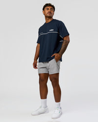 Man wearing Inline Heavyweight FLXCotton Oversized Tee - Midnight Navy-White | Model:Xav | Size:L | Thumbnail Index: 13