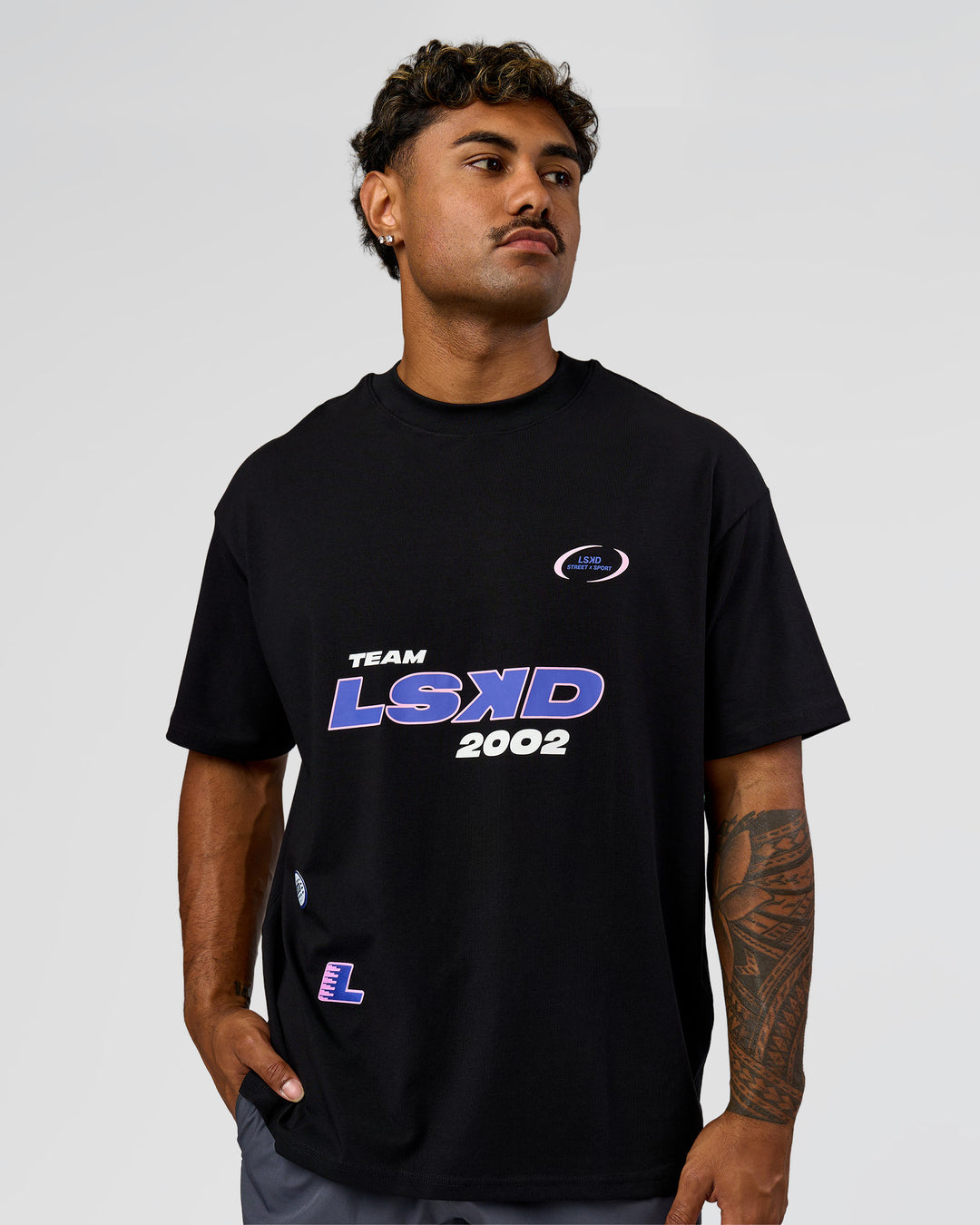 Man wearing League Heavyweight FLXCotton Oversized Tee - Black-Power Cobalt | Model:Xav | Size:L - view 2