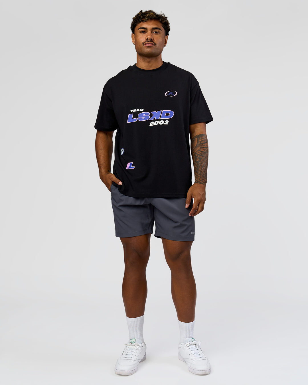Man wearing League Heavyweight FLXCotton Oversized Tee - Black-Power Cobalt | Model:Xav | Size:L - view 8