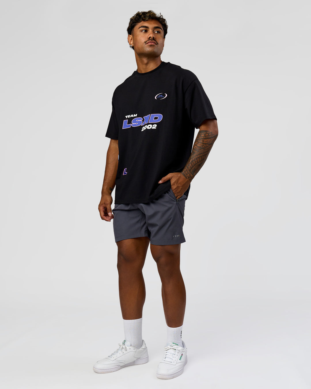 Man wearing League Heavyweight FLXCotton Oversized Tee - Black-Power Cobalt | Model:Xav | Size:L - view 12