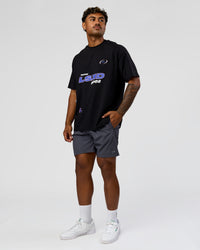 Man wearing League Heavyweight FLXCotton Oversized Tee - Black-Power Cobalt | Model:Xav | Size:L | Thumbnail Index: 11