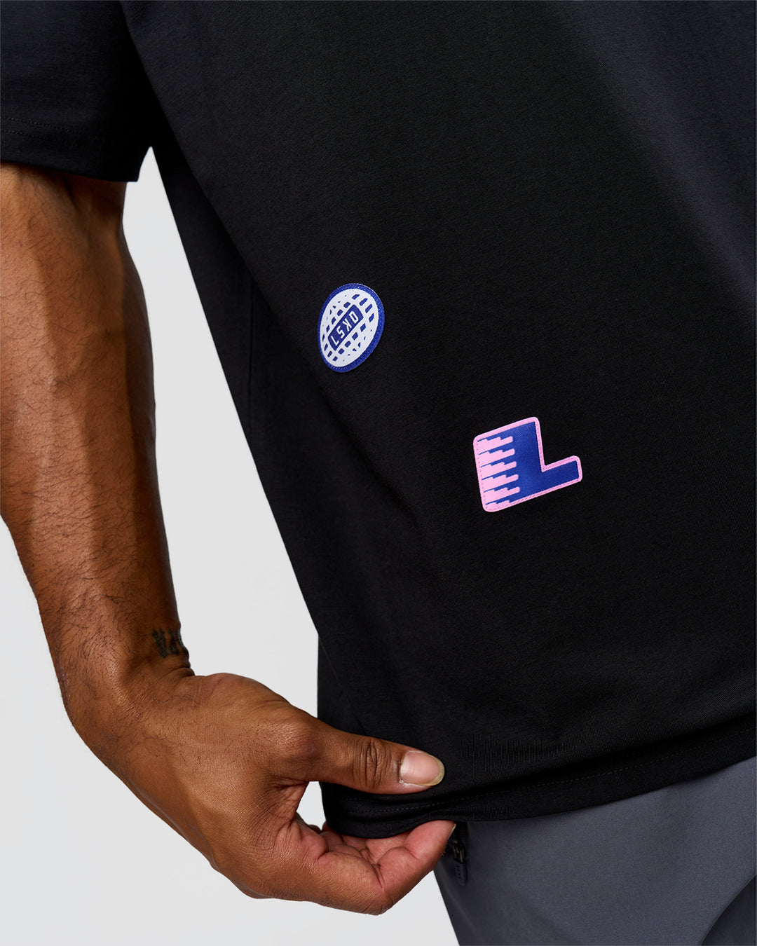 Man wearing League Heavyweight FLXCotton Oversized Tee - Black-Power Cobalt | Model:Xav | Size:L - view 3