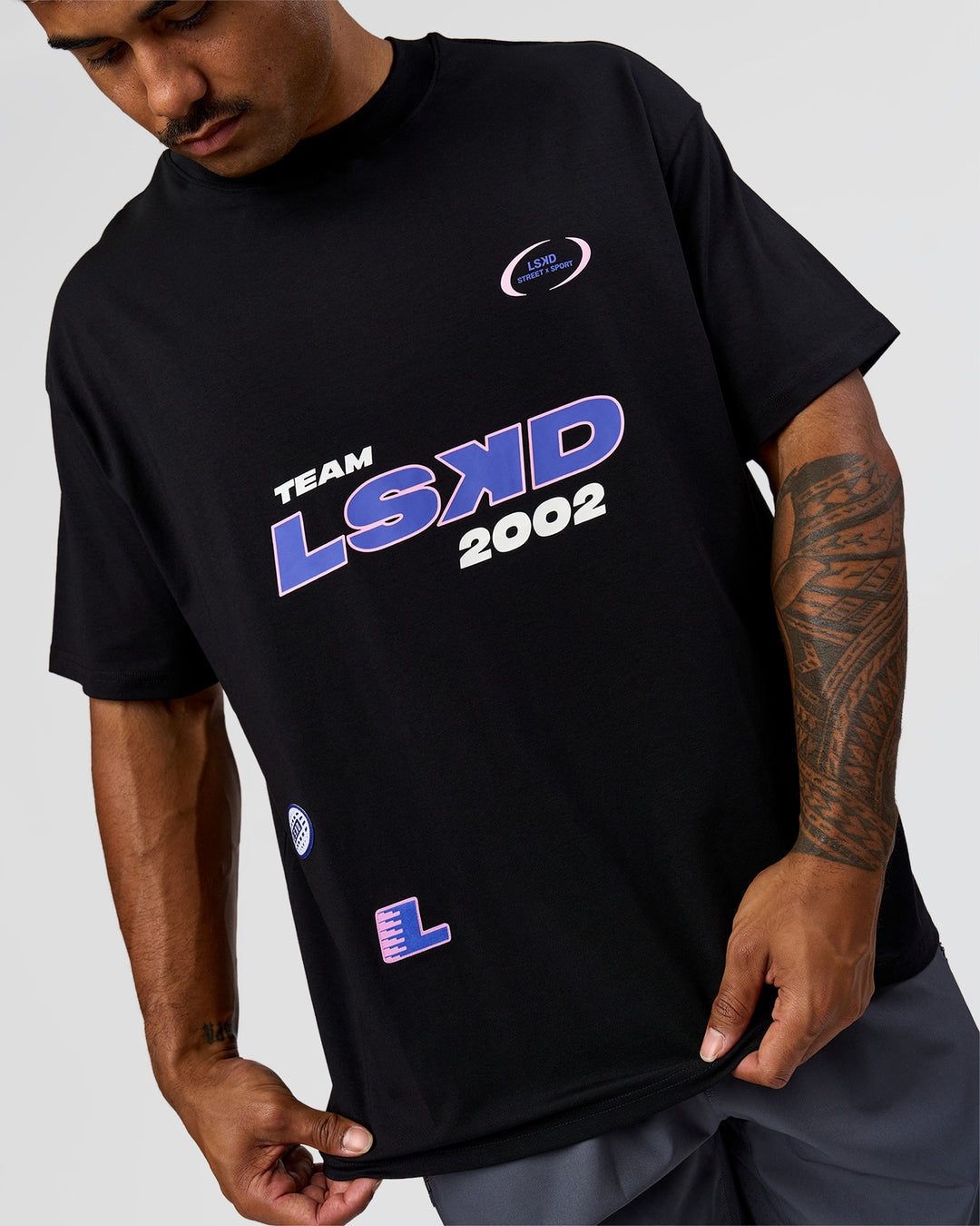 Man wearing League Heavyweight FLXCotton Oversized Tee - Black-Power Cobalt | Model:Xav | Size:L - view 7