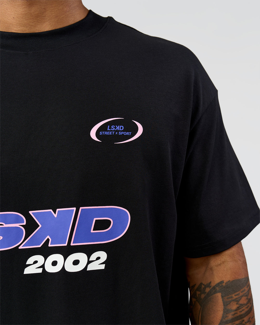 Man wearing League Heavyweight FLXCotton Oversized Tee - Black-Power Cobalt | Model:Xav | Size:L - view 16