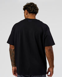 Man wearing League Heavyweight FLXCotton Oversized Tee - Black-Power Cobalt | Model:Xav | Size:L | Thumbnail Index: 16