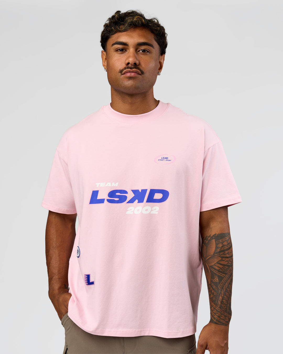 Man wearing League Heavyweight FLXCotton Oversized Tee - Marshmallow-Power Cobalt | Model:Xav | Size:L - view 2