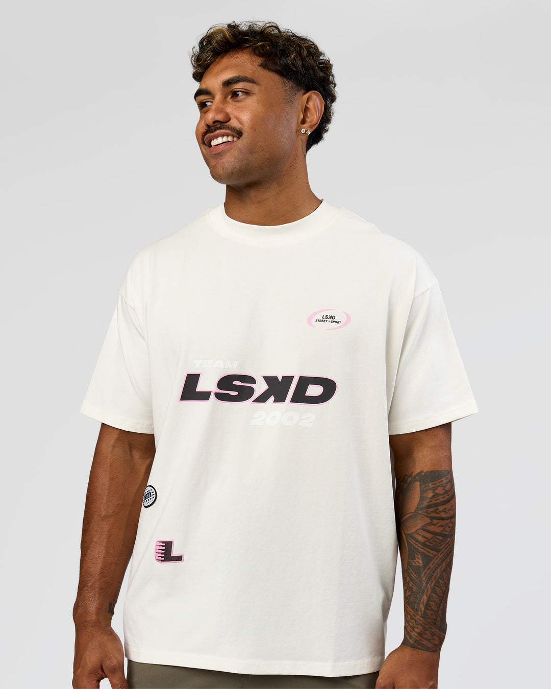 Man wearing League Heavyweight FLXCotton Oversized Tee - Off White-Ground Coffee | Model:Xav | Size:L - view 2