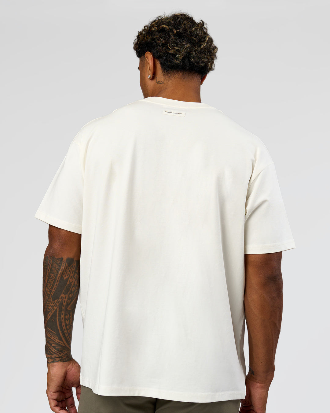 Man wearing League Heavyweight FLXCotton Oversized Tee - Off White-Ground Coffee | Model:Xav | Size:L - view 5