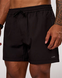 Man wearing Rep 5" Performance Short - Black | Model:Xav | Size:L | Thumbnail Index: 0