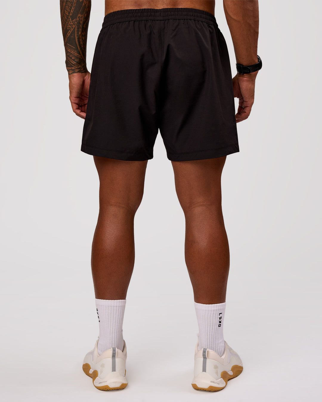Man wearing Rep 5" Performance Short - Black | Model:Xav | Size:L - view 4