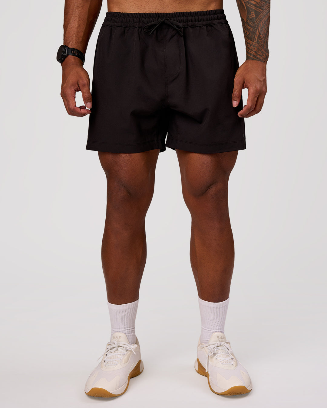 Man wearing Rep 5" Performance Short - Black | Model:Xav | Size:L - view 6