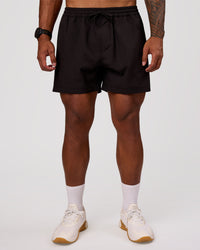 Man wearing Rep 5" Performance Short - Black | Model:Xav | Size:L | Thumbnail Index: 5