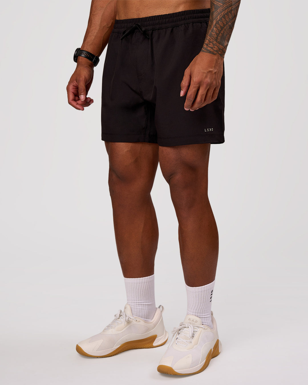 Man wearing Rep 5" Performance Short - Black | Model:Xav | Size:L - view 7