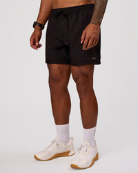 Man wearing Rep 5" Performance Short - Black | Model:Xav | Size:L | Thumbnail Index: 6