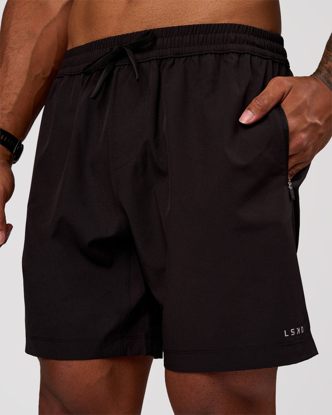 Man wearing Rep 7" Performance Short - Black-White | Model:Xav | Size:L - view 1