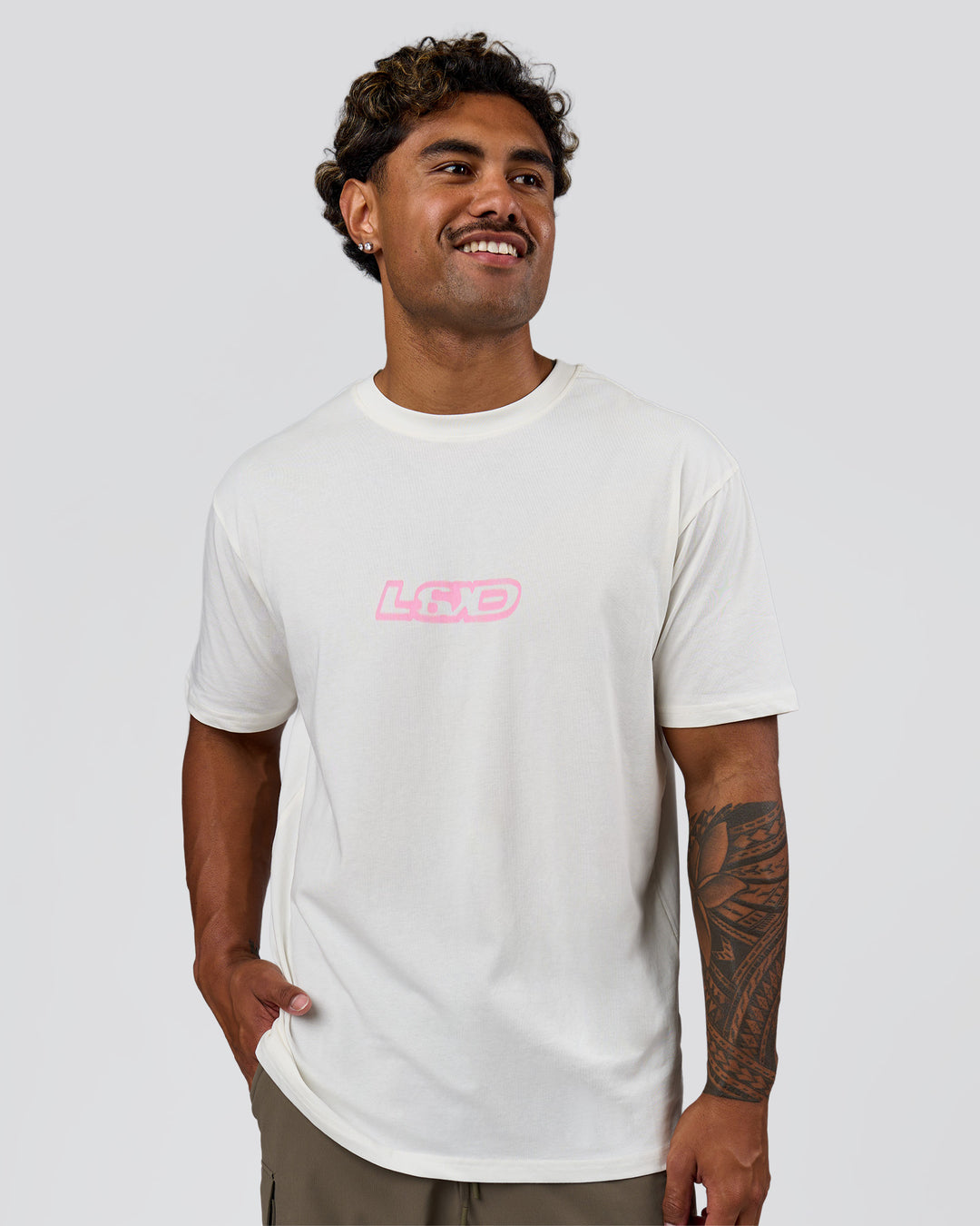 Man wearing SoCal 26 FLXCotton Oversize Tee  - Off White-Pink Rose | Model:Xav | Size:L - view 5