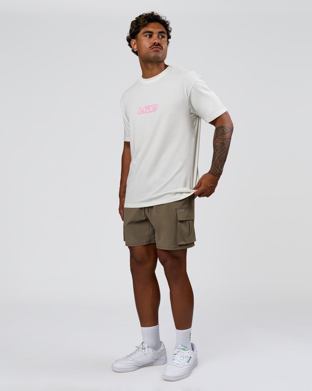 Man wearing SoCal 26 FLXCotton Oversize Tee  - Off White-Pink Rose | Model:Xav | Size:L - view 12