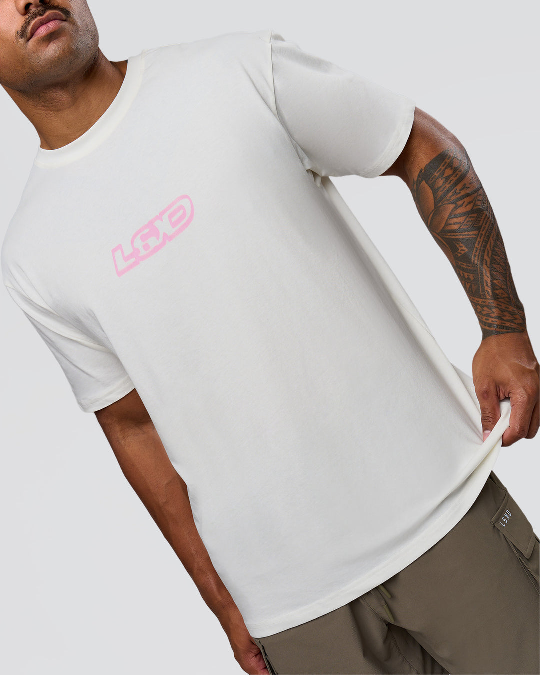 Man wearing SoCal 26 FLXCotton Oversize Tee  - Off White-Pink Rose | Model:Xav | Size:L - view 14