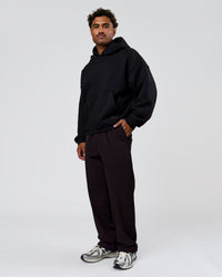 Man wearing Tonal Legacy Boxy Hoodie - Black-Black | Model:Xav | Size:L | Thumbnail Index: 9