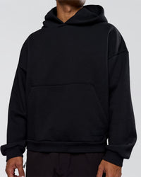 Man wearing Tonal Legacy Boxy Hoodie - Black-Black | Model:Xav | Size:L | Thumbnail Index: 11