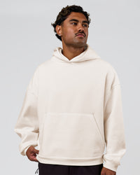 Man wearing Tonal Legacy Boxy Hoodie - Off White-Off White | Model:Xav | Size:L | Thumbnail Index: 4