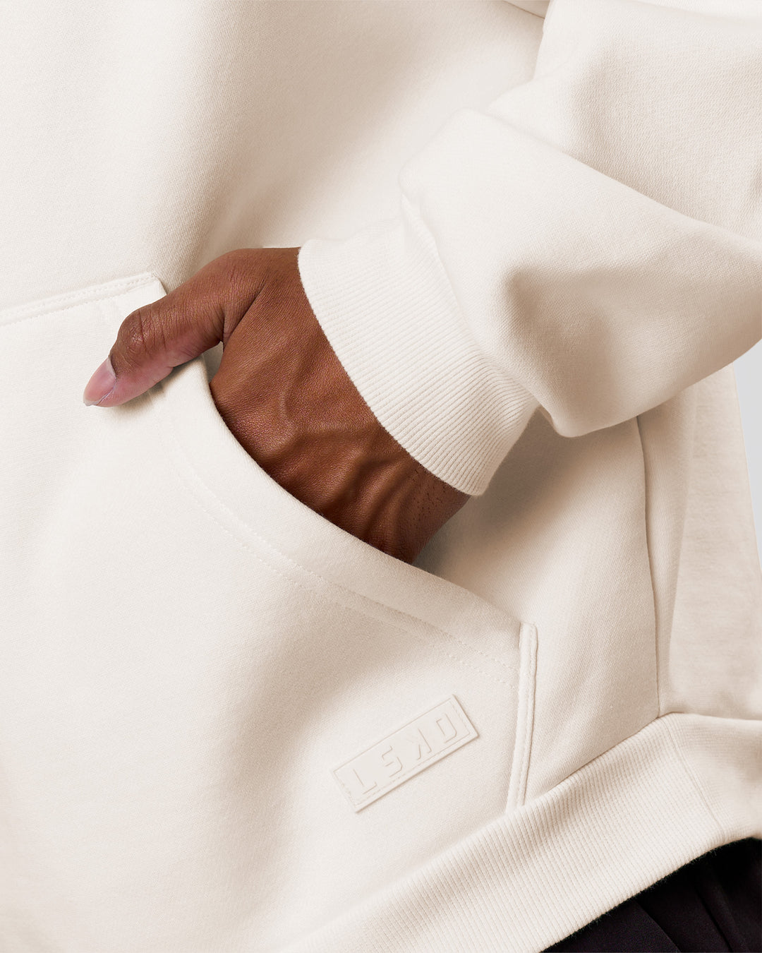 Man wearing Tonal Legacy Boxy Hoodie - Off White-Off White | Model:Xav | Size:L - view 17