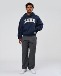Man wearing Varsity Boxy Hoodie - Future Navy-White | Model:Xav | Size:L | Thumbnail Index: 9