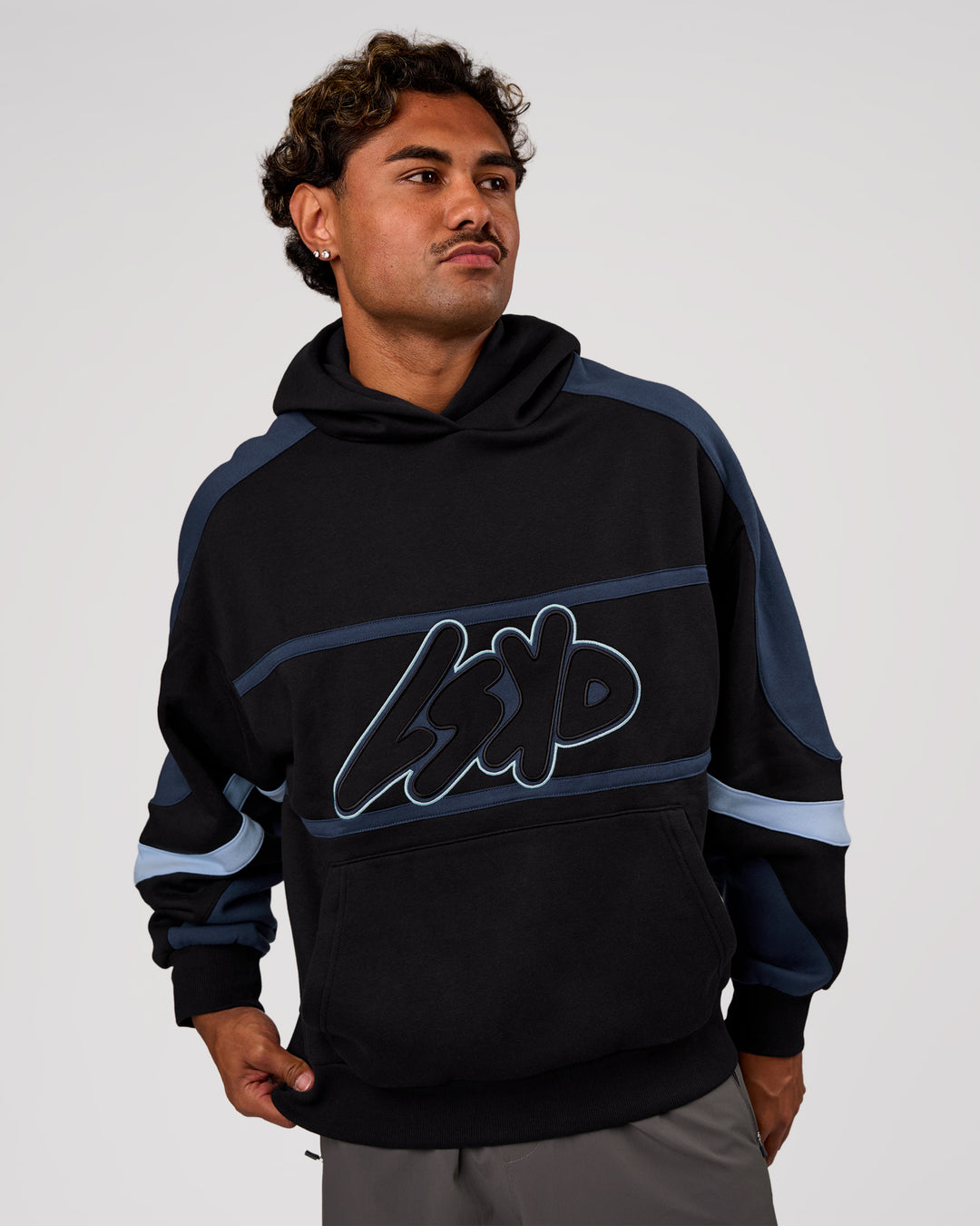 Man wearing Vibe Oversized Hoodie - Black-Future Navy | Model:Xav | Size:L - view 2